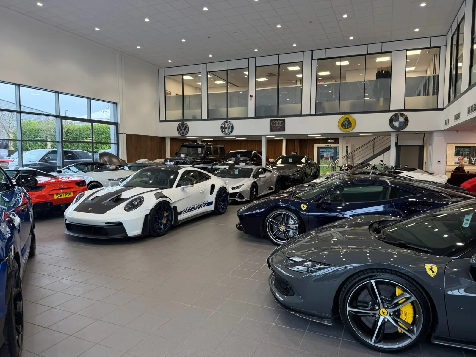 Pest Control Harrogate | Protecting £Million Prestige Stock 4 Red Line Cars Harrogate prestige showroom displaying Ferrari Porsche protected by professional commercial pest control services