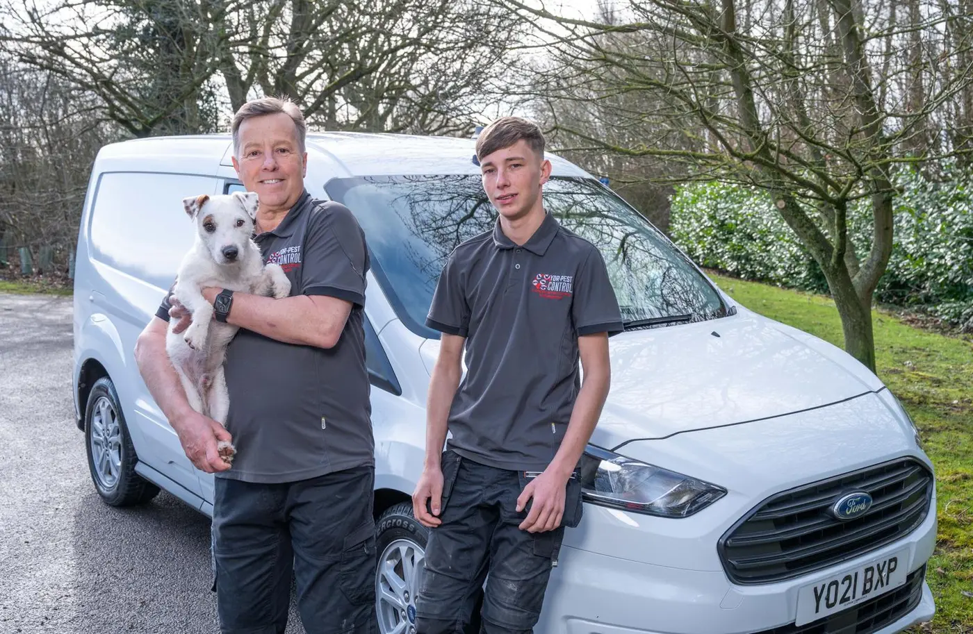 Yor-Pest Control team with company van and Jack Russell terrier in York Harrogate area showing professional pest control service
